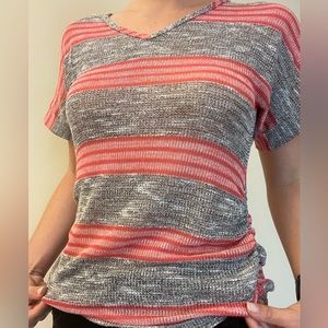 Simple, pink and gray lined t-shirt. Material is soft and breathable.